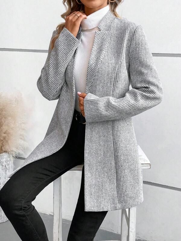 Grey collarless long-sleeve overcoat with structured front and button closure