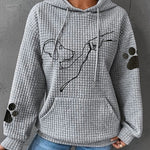 Women’s gray pullover hoodie with hood and pouch pocket, dog graphic, paw-print sleeves