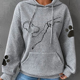 Women’s gray pullover hoodie with hood and pouch pocket, dog graphic, paw-print sleeves