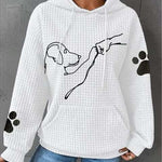 Women’s white pullover hoodie with hood and pouch pocket, dog graphic, paw-print sleeves