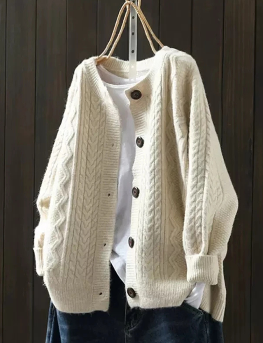 Beige cable-knit cardigan with button front and ribbed trim