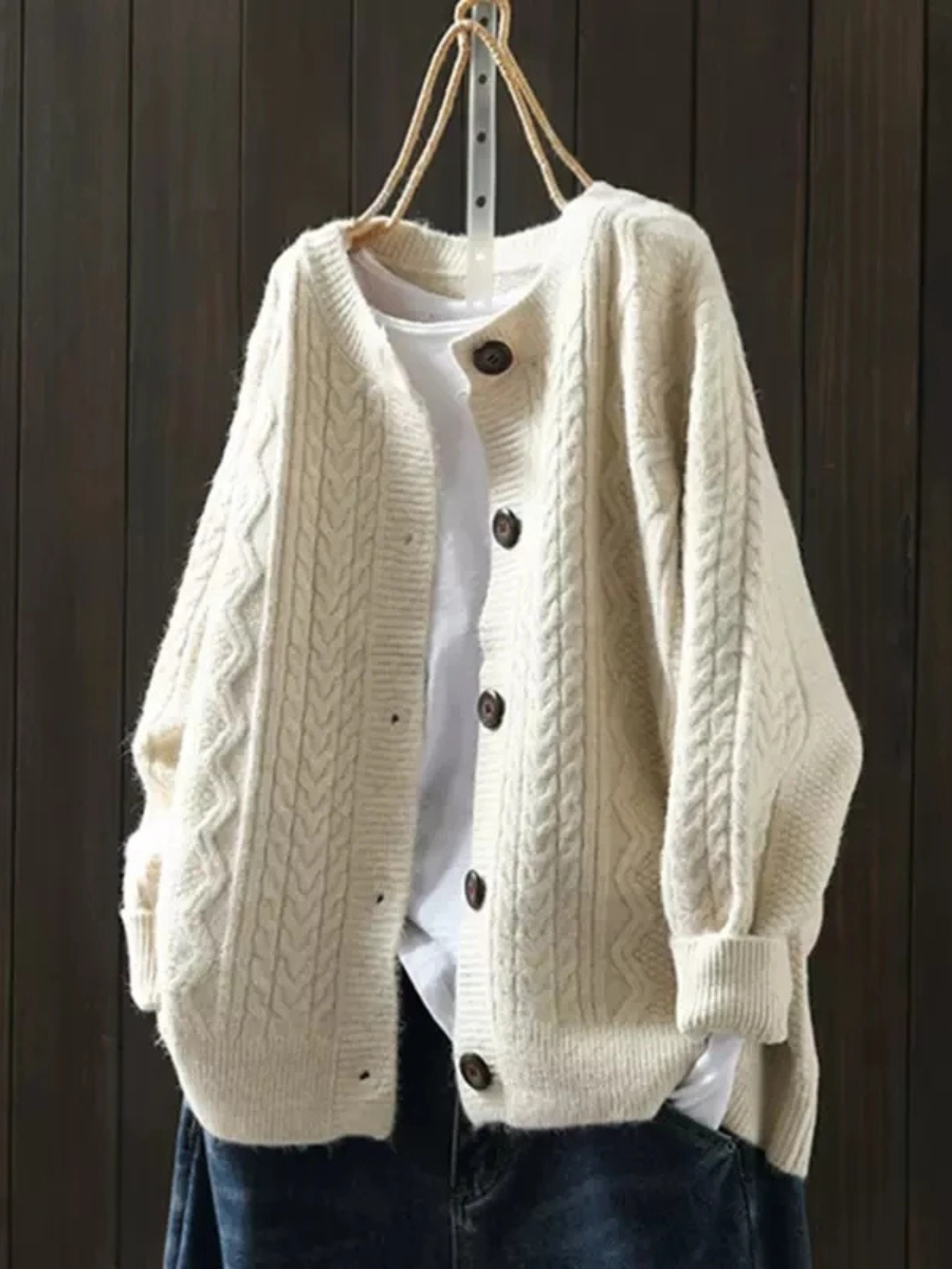 Beige cable-knit cardigan with button front and ribbed trim