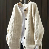 Beige cable-knit cardigan with button front and ribbed trim