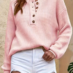 Pink knit pullover henley sweater with button-front placket and long sleeves
