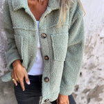 Green short wool jacket with lapels, button front, chest pockets, long sleeves
