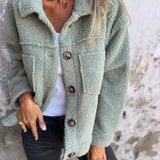 Green short wool jacket with lapels, button front, chest pockets, long sleeves