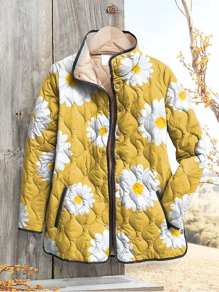 Women’s yellow quilted jacket with white daisy pattern, button front and hood
