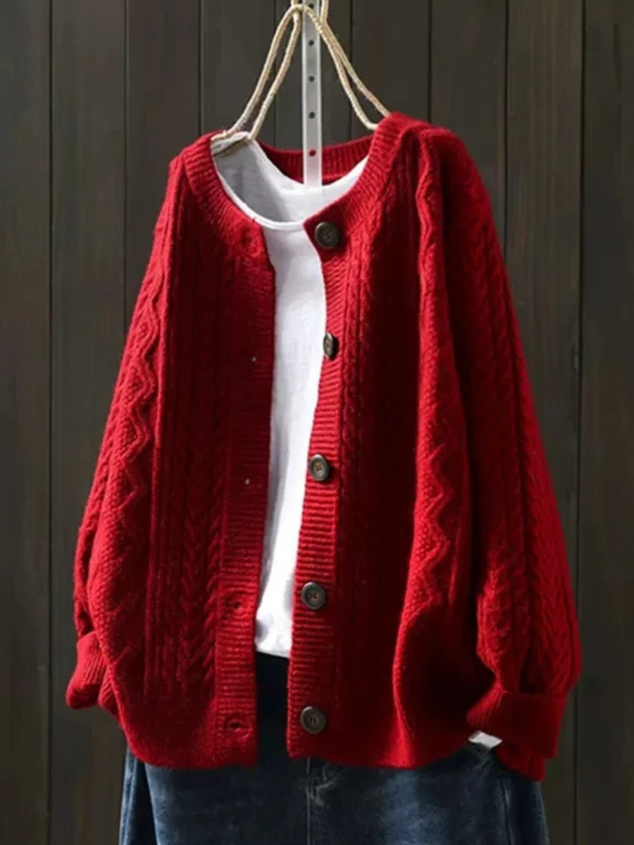 Red cable-knit cardigan with button front and ribbed cuffs