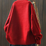 Red cable-knit sweater-cardigan with ribbed hem and cuffs