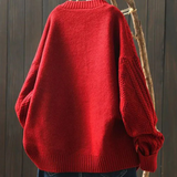 Red cable-knit sweater-cardigan with ribbed hem and cuffs