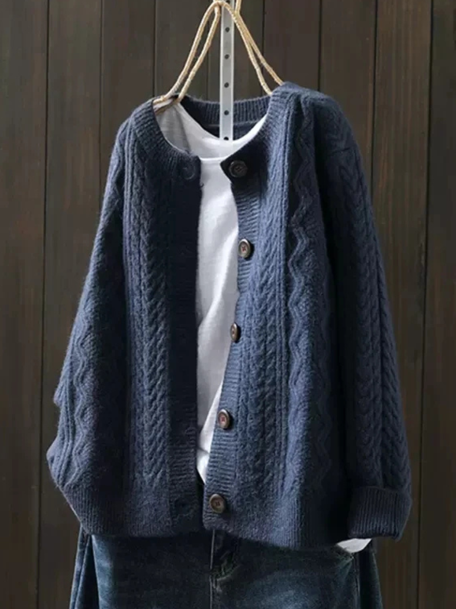 Navy cable-knit cardigan with button placket and ribbed neckline