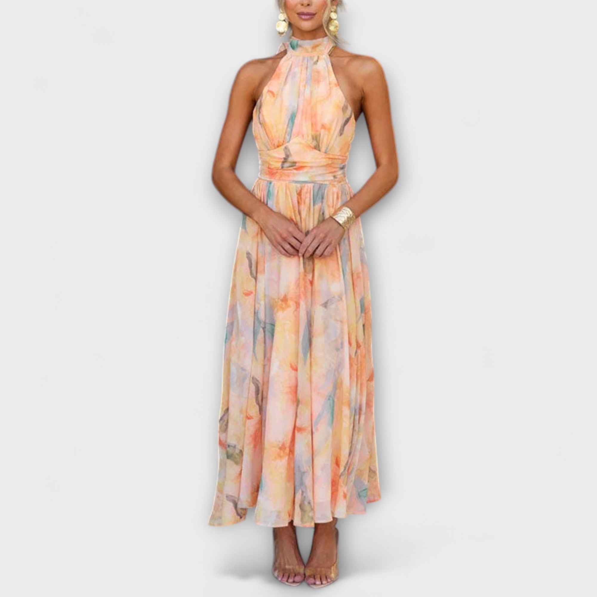 Watercolor halter maxi dress with pastel orange, blue, and yellow print