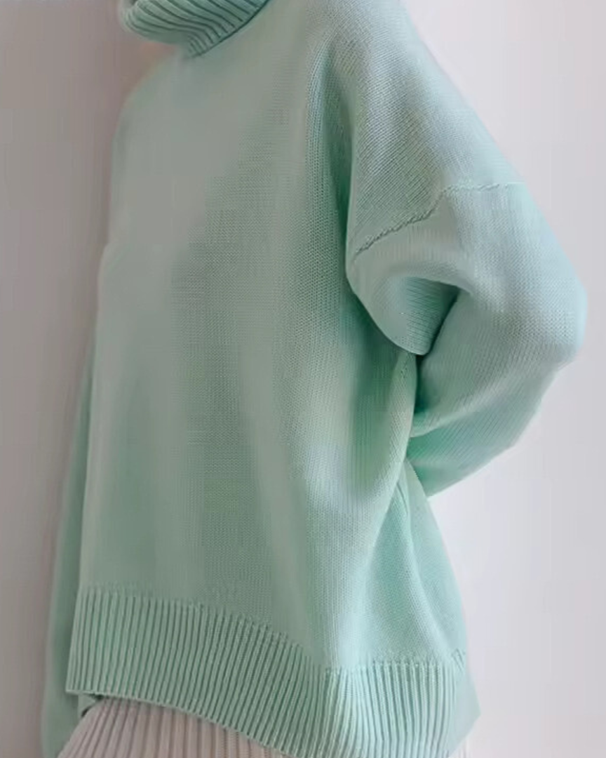 Oversized mint green turtleneck knit sweater with ribbed collar and hem