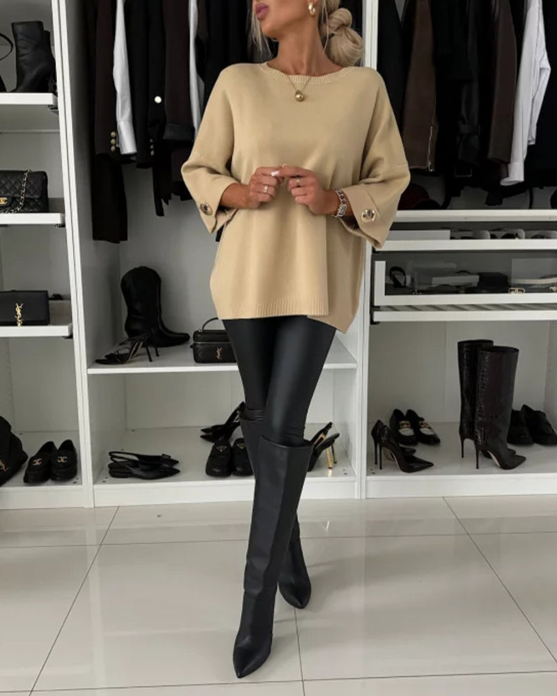 Beige knit pullover with wide sleeves and crew neck, ribbed hem and cuffs
