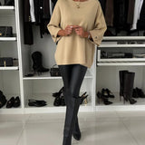 Beige knit pullover with wide sleeves and crew neck, ribbed hem and cuffs