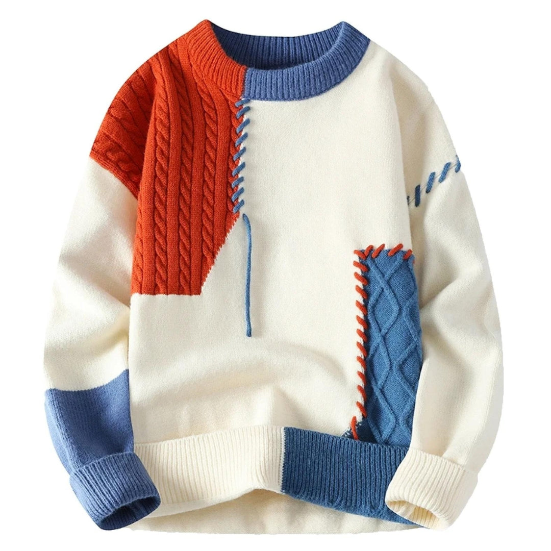 Color-block knit sweater in cream with orange cable panel, blue ribbed collar and cuffs