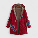 Red hooded parka jacket with abstract circular print, front zipper, warm lined hood.