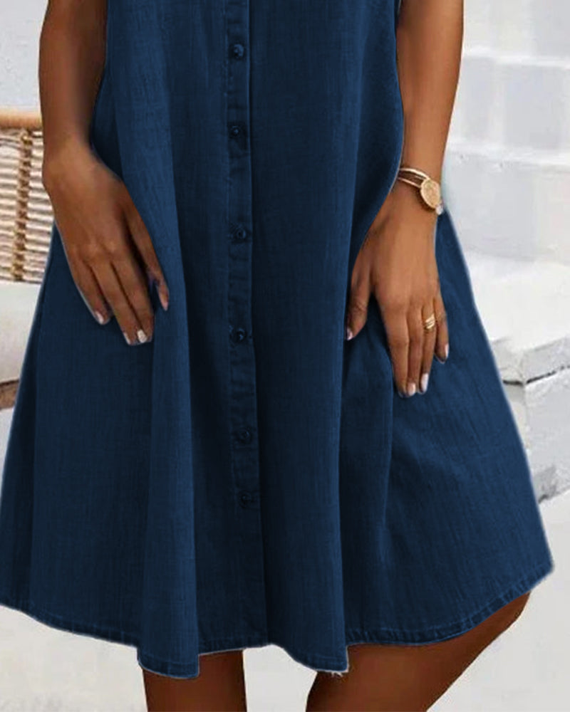 Dark blue denim shirt dress with button front and flared hem, knee-length