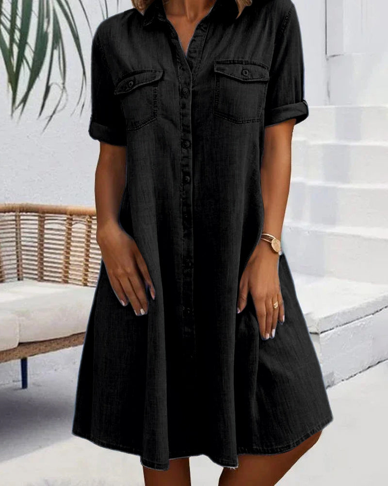 Black denim shirt dress with short sleeves, button front, and chest pockets