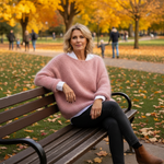 Dusty pink soft-knit pullover with long sleeves and crew neckline, relaxed silhouette.