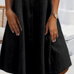 Black denim shirt dress with short sleeves, button front, and flared skirt