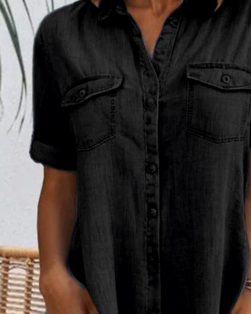 Black denim shirt dress front detail with button placket and chest pockets