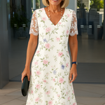 White floral midi dress with lace-trim short sleeves and V-neck, straight front