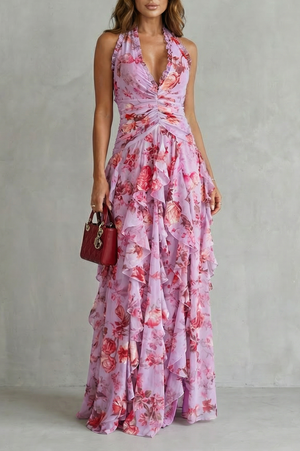 Pink floral halter maxi dress with draped bodice and tiered ruffle skirt