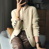 Beige knit cardigan with button front, long sleeves, ribbed cuffs