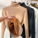 Beige fleece-lined turtleneck sweater with ribbed cuffs and hem detail