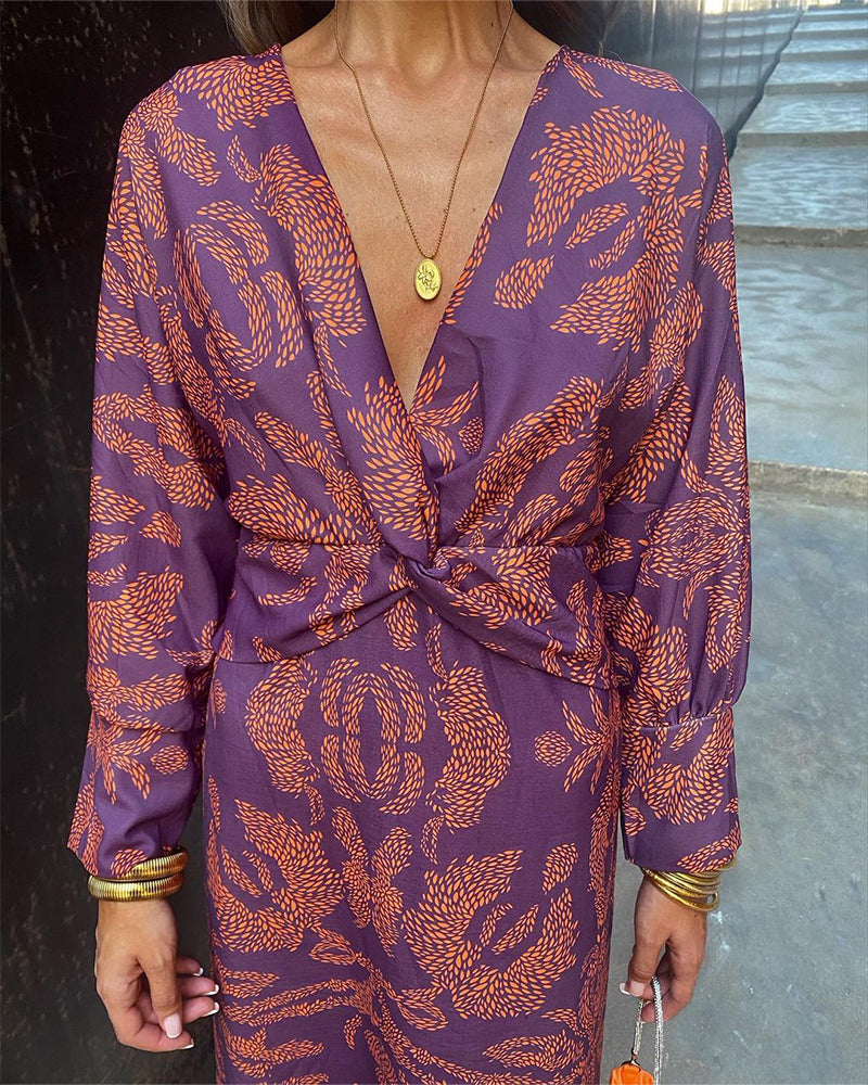 Lara™ elegant dress, purple with orange leaf print, deep V-neck and knotted waist
