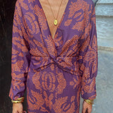 Lara™ elegant dress, purple with orange leaf print, deep V-neck and knotted waist