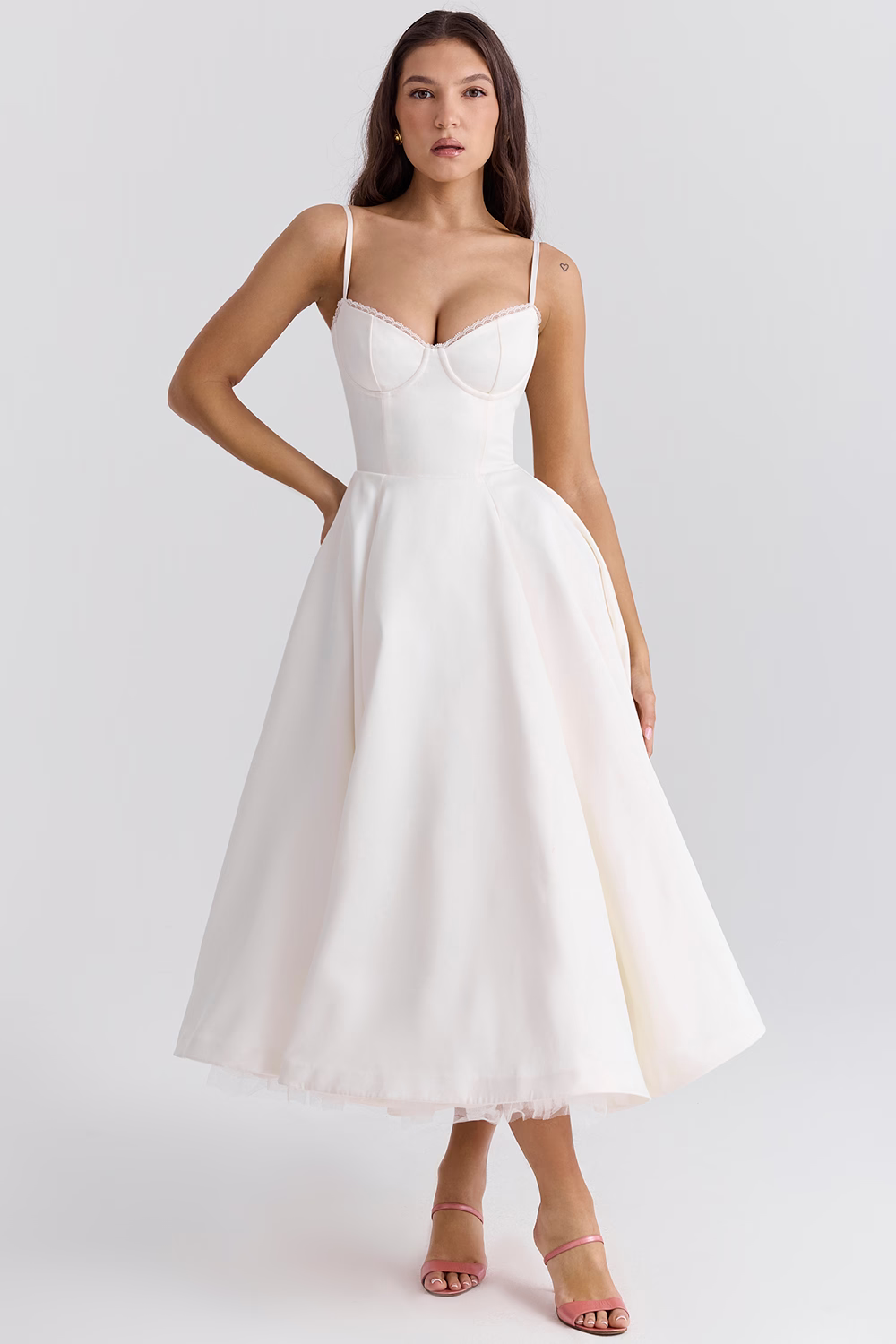 White corset bodice dress with spaghetti straps and flared midi skirt