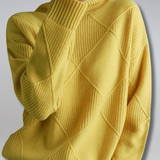 Yellow ribbed turtleneck sweater with diamond knit panels and long sleeves