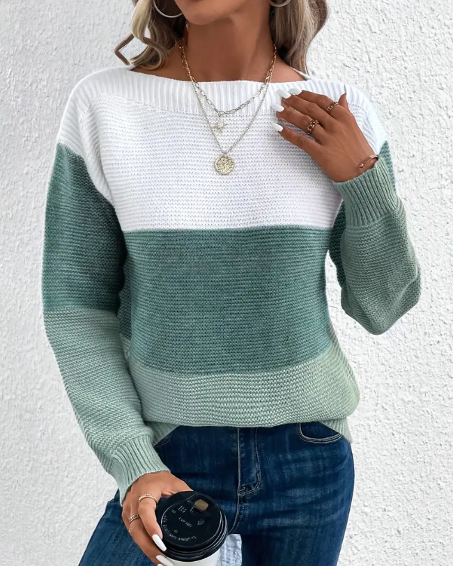 Two-tone long-sleeve sweater with crew neck, white top and green lower panel