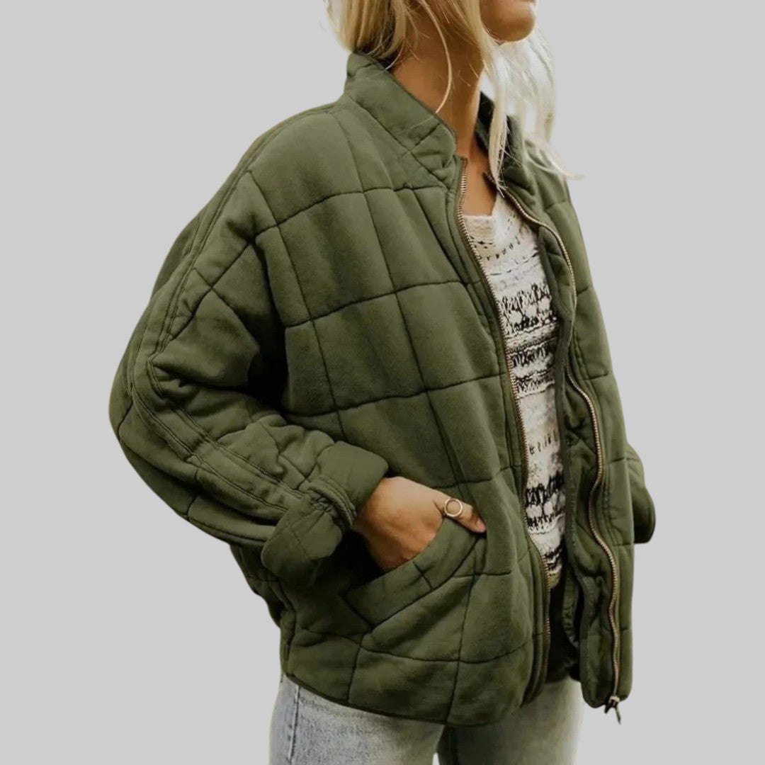 Green quilted oversize step jacket with zip front, stand collar, and side pockets