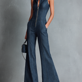 Dunkelblauer, ärmelloser Jumpsuit im Retro-Stil für Damen mit Stehkragen, ausgestelltem Schnitt und Reißverschluss vorne.