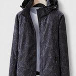 Dark hooded jacket with front zipper and stand collar, leaf-patterned fabric