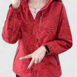 Red hooded jacket with front zipper, ruffled hood edge and leaf-patterned texture