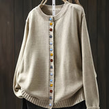 Cream cardigan sweater with multicolor button front and ribbed crew neckline