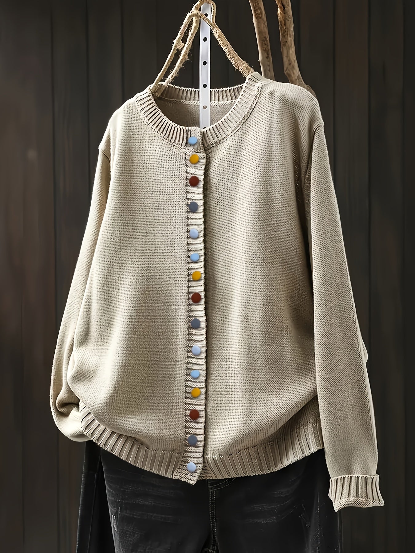 Cream cardigan sweater with multicolor button front and ribbed crew neckline