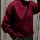 Burgundy knit turtleneck sweater with long sleeves and ribbed collar