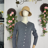 Grey long-sleeve button-front pullover on mannequin with V-neck