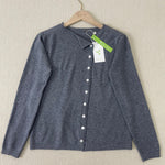Grey button-front knit pullover with V-neck and long sleeves on hanger