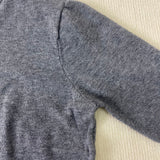 Grey heather knit pullover shoulder and sleeve seam detail