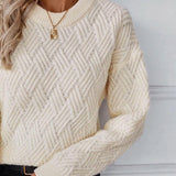 Cream textured knit sweater with long sleeves and crew neck