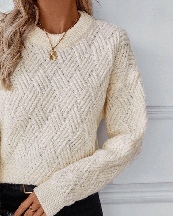 Cream textured knit sweater with long sleeves and crew neck