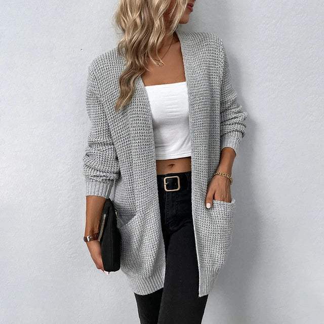 Gray knit cardigan with open front, long sleeves, and front pockets