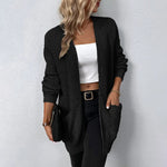 Black knit cardigan with open front, long sleeves, and front pockets
