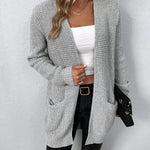 Light gray knit cardigan with open front and long sleeves, front pocket detail